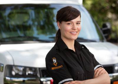 woman standing in front of an ambulance